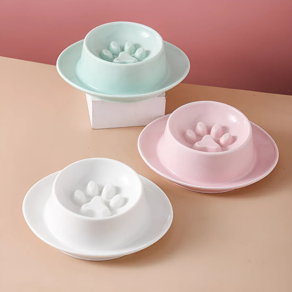Green ceramic pet bowl with raised neck protection collar and anti-knock slow feed design