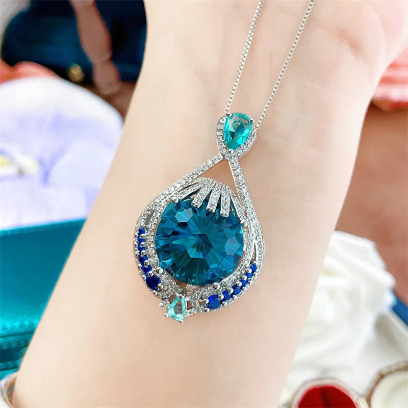 Blue crystal geometric-cut fireworks pendant necklace on water wave chain for women