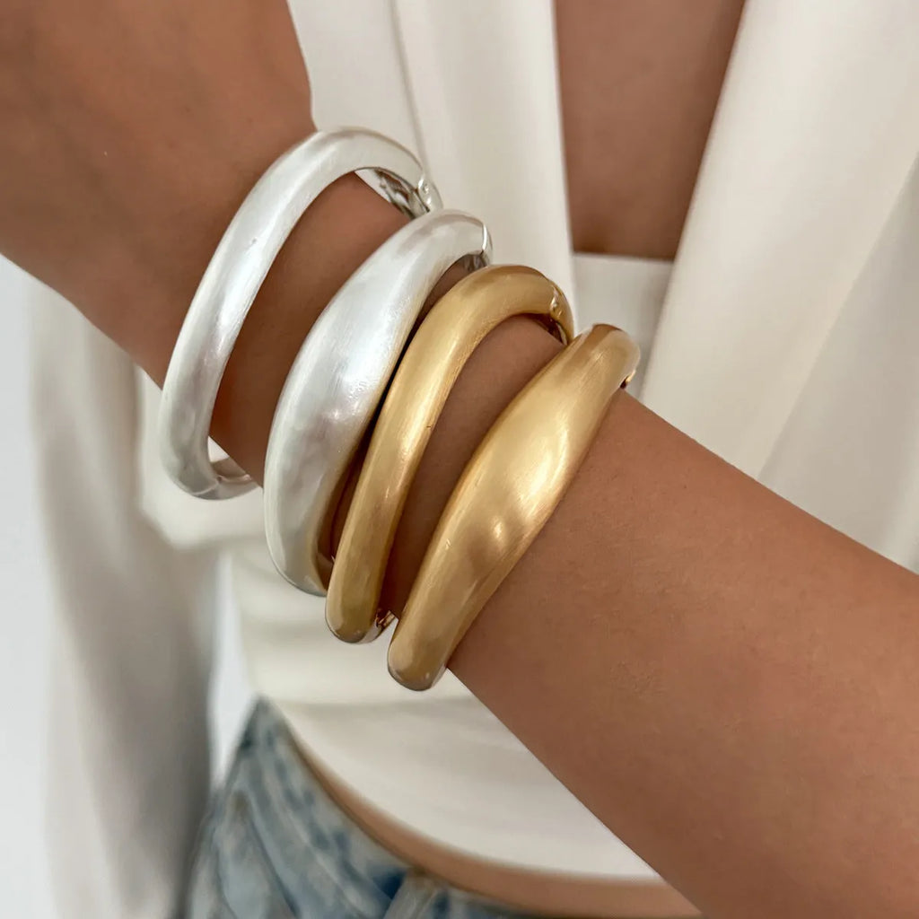Matte finish alloy bracelet with ellipse design, electroplated ins style, shown in matte gold and matte silver options.