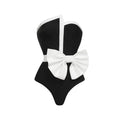 Women's black and white colour-block one-piece swimsuit with asymmetric bow detail