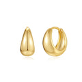 A pair of round geometric brass clip earrings with a gold electroplated finish on a white background.