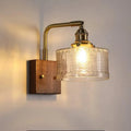 American retro wall lamp with walnut glass brass construction, green glass shade, installed on living room wall