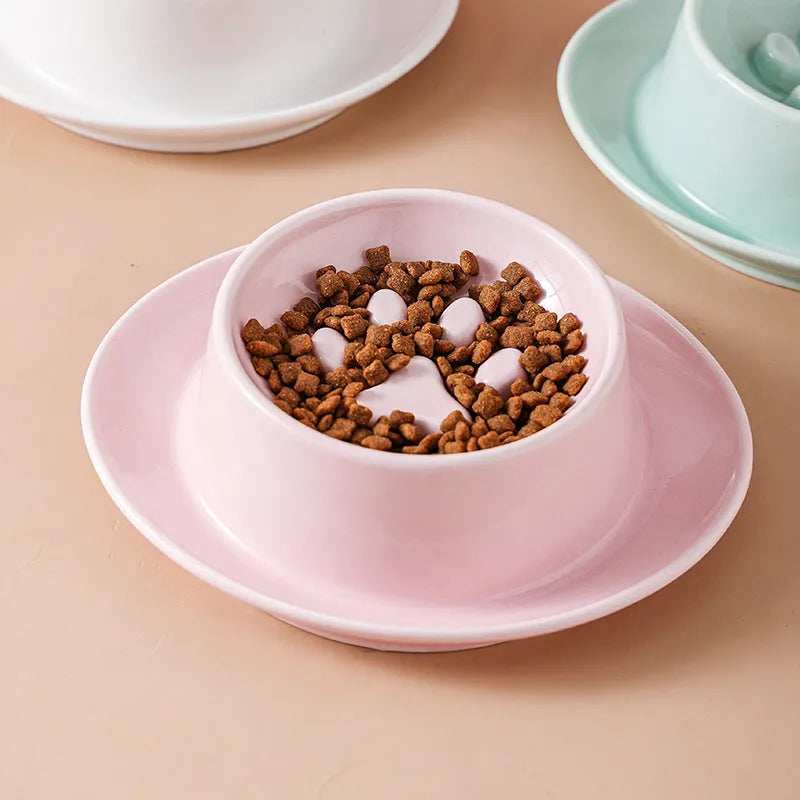 Green ceramic pet bowl with raised neck protection collar and anti-knock slow feed design