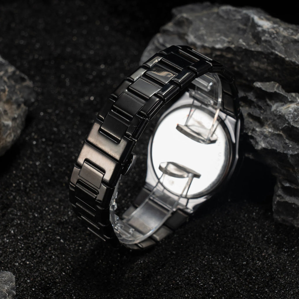 Men's business casual watch with stainless steel band and black dial on wrist
