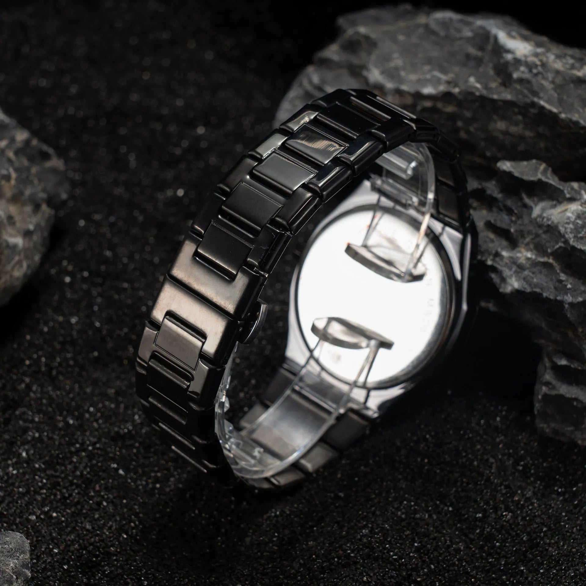 Men's business casual watch with stainless steel band and black dial on wrist