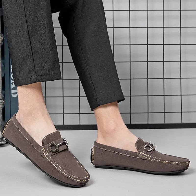 Men's brown casual leather shoes with round toe and rubber sole on a neutral background