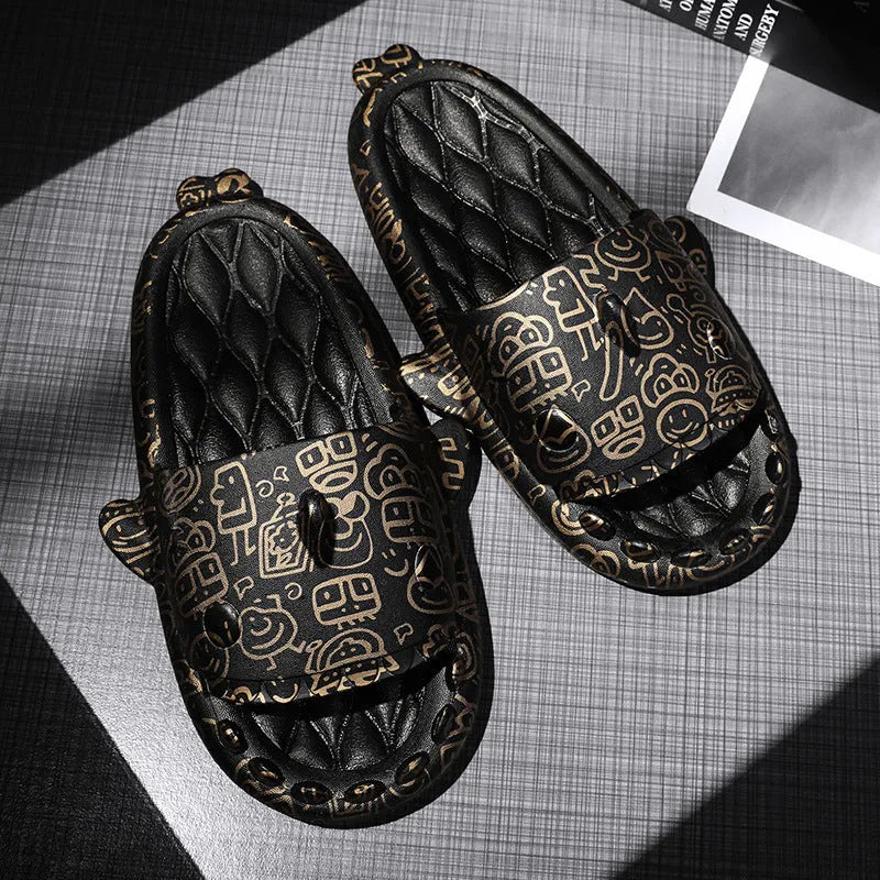 Pair of open-toe EVA slippers with a shark couple design on the footbed.