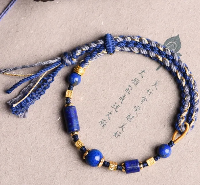 Close-up of a hand-woven flexible wire bracelet for women with a Lapis Lazuli stone accent.
