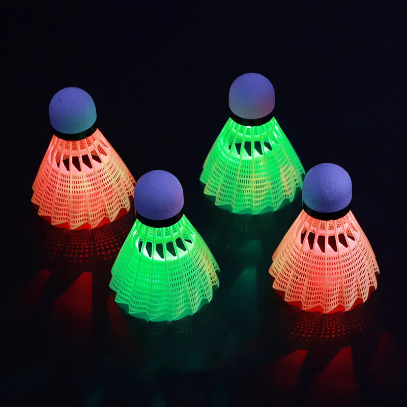 Green and red glowing badminton shuttlecocks for table tennis, shown in goose feather and nylon types.