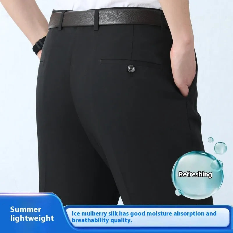 Man wearing dark blue straight-cut high-waist business trousers made from a mulberry silk blend.