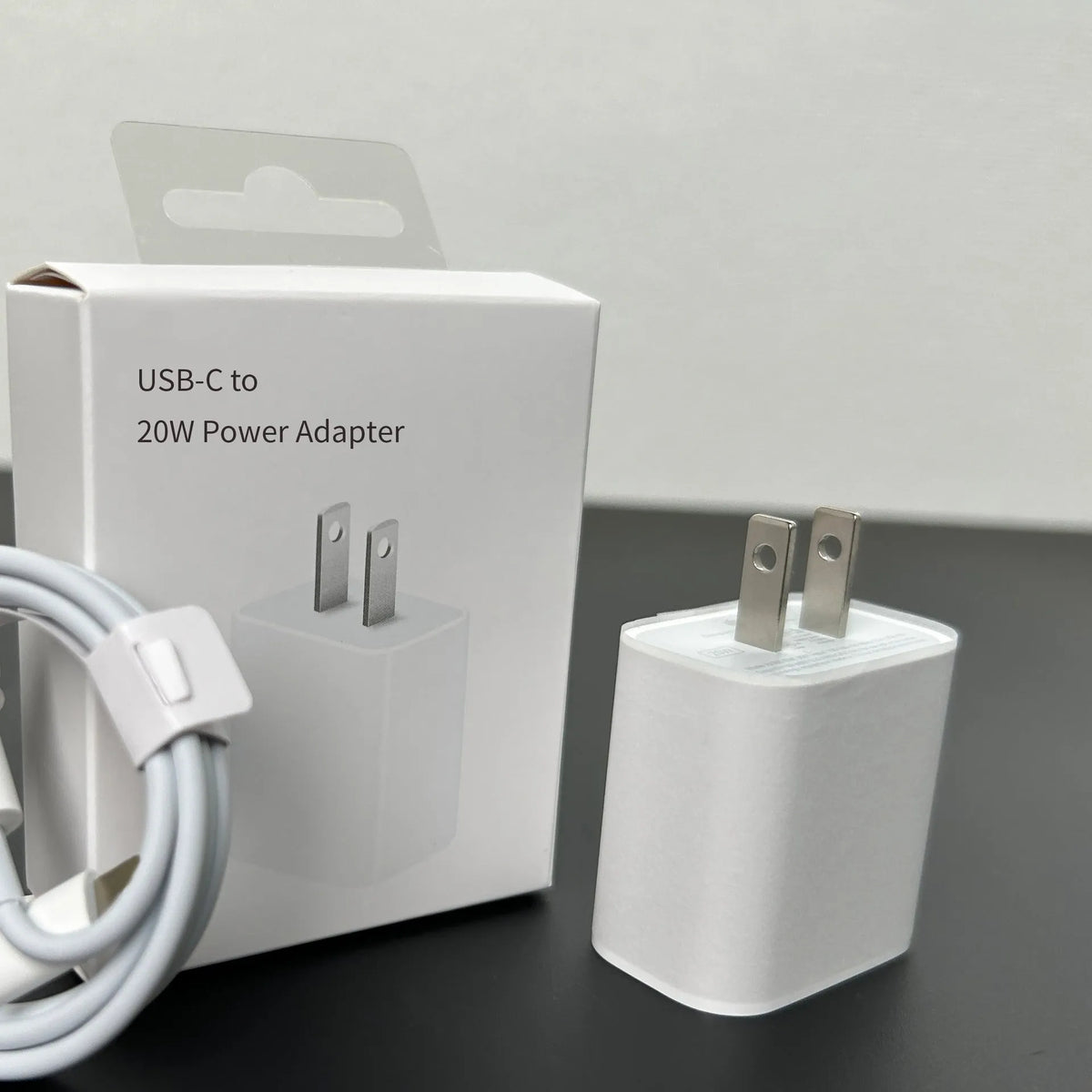 White 20W PD charger with USB-C port and international plug adapters