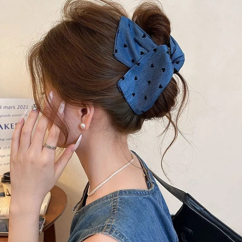 Women's denim bow triangle hair grip with fabric and acrylic details on plastic hairpin