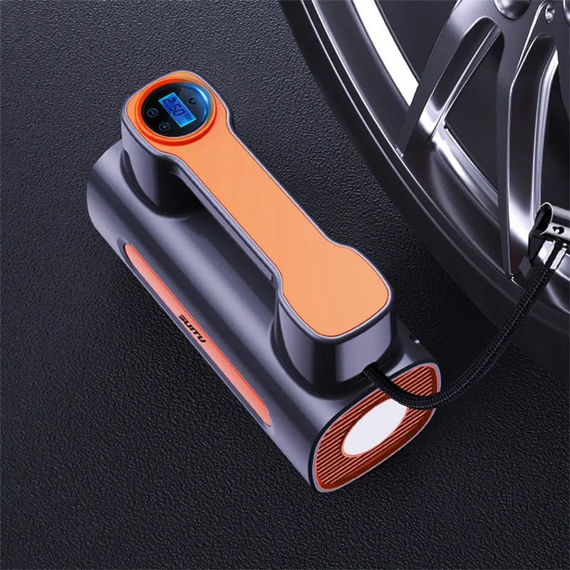 Black portable cordless tyre inflator with digital LCD screen on a grey background