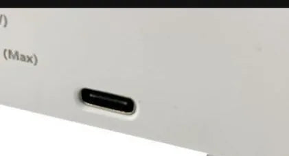 White multifunctional 3-in-1 LED night light with app control, RGB atmosphere lamp, wireless charger, and alarm clock on a desk
