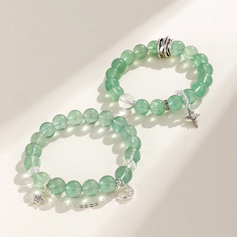 Green fluorite bracelet with star and moon princess design showing natural stone asterism patterns