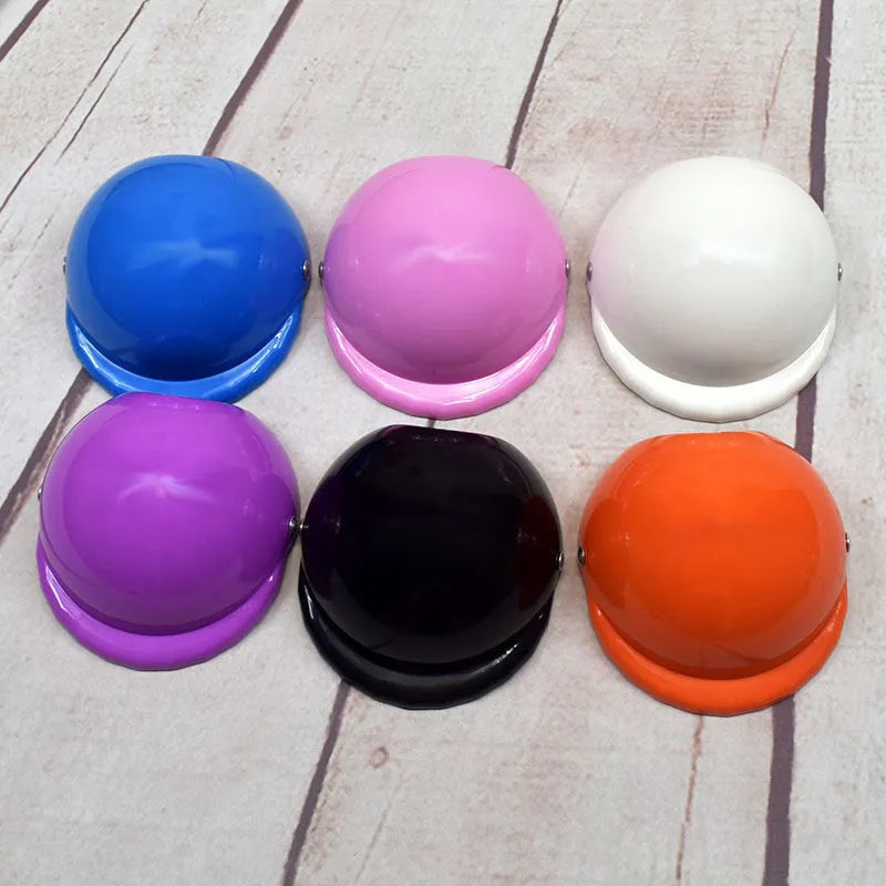 Plastic dog motorcycle helmet in pink colour showing size options for small medium large dogs