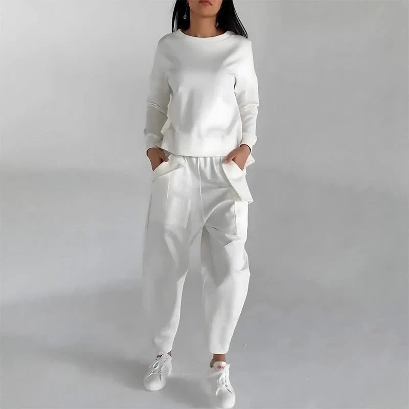 Stylish polyester sweatshirt with unique back slit design and convenient pockets for a fashionable and functional look.