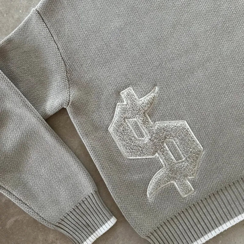 Grey loose-fitting jacquard knit coat for women, long sleeve pullover style.