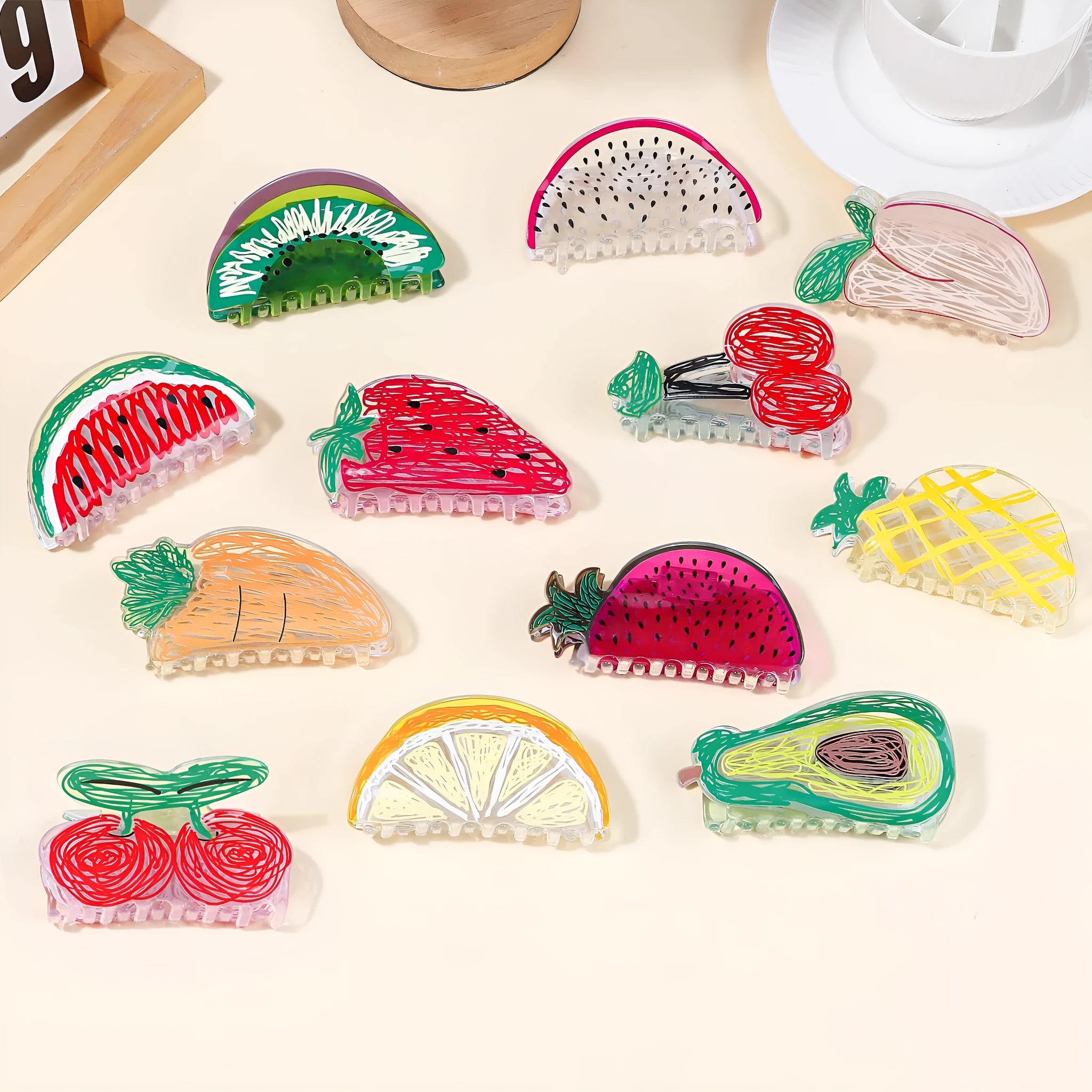 Korean creative fruit transparent PVC hair grip with asymmetric design on a white background