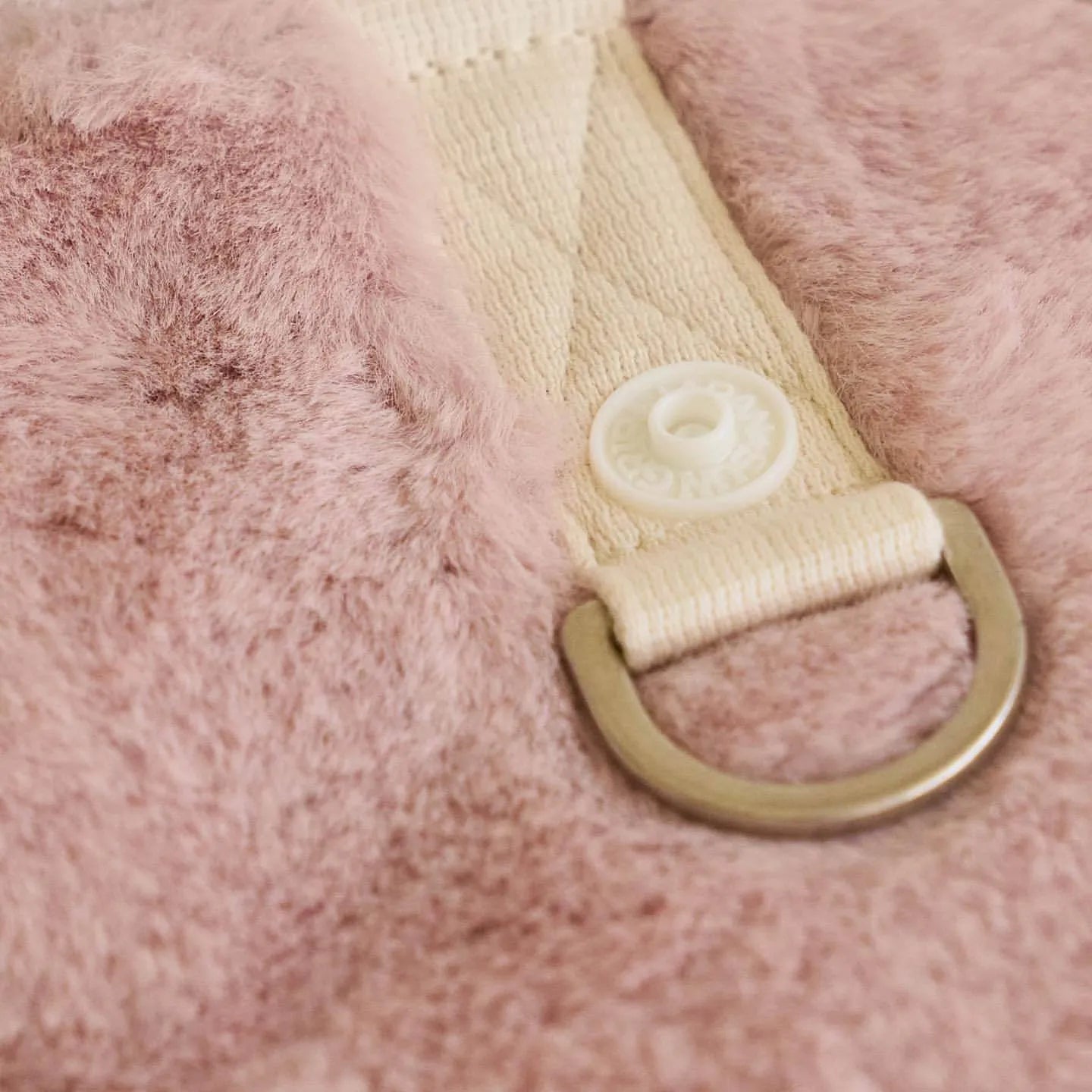Light pink polyester dog coat shown on canine model, casual style with basic coverage design