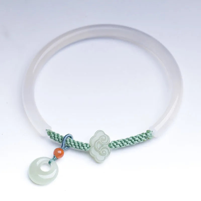 Handmade natural white agate bracelet with jade green Hetian jade charm on an adjustable cord.