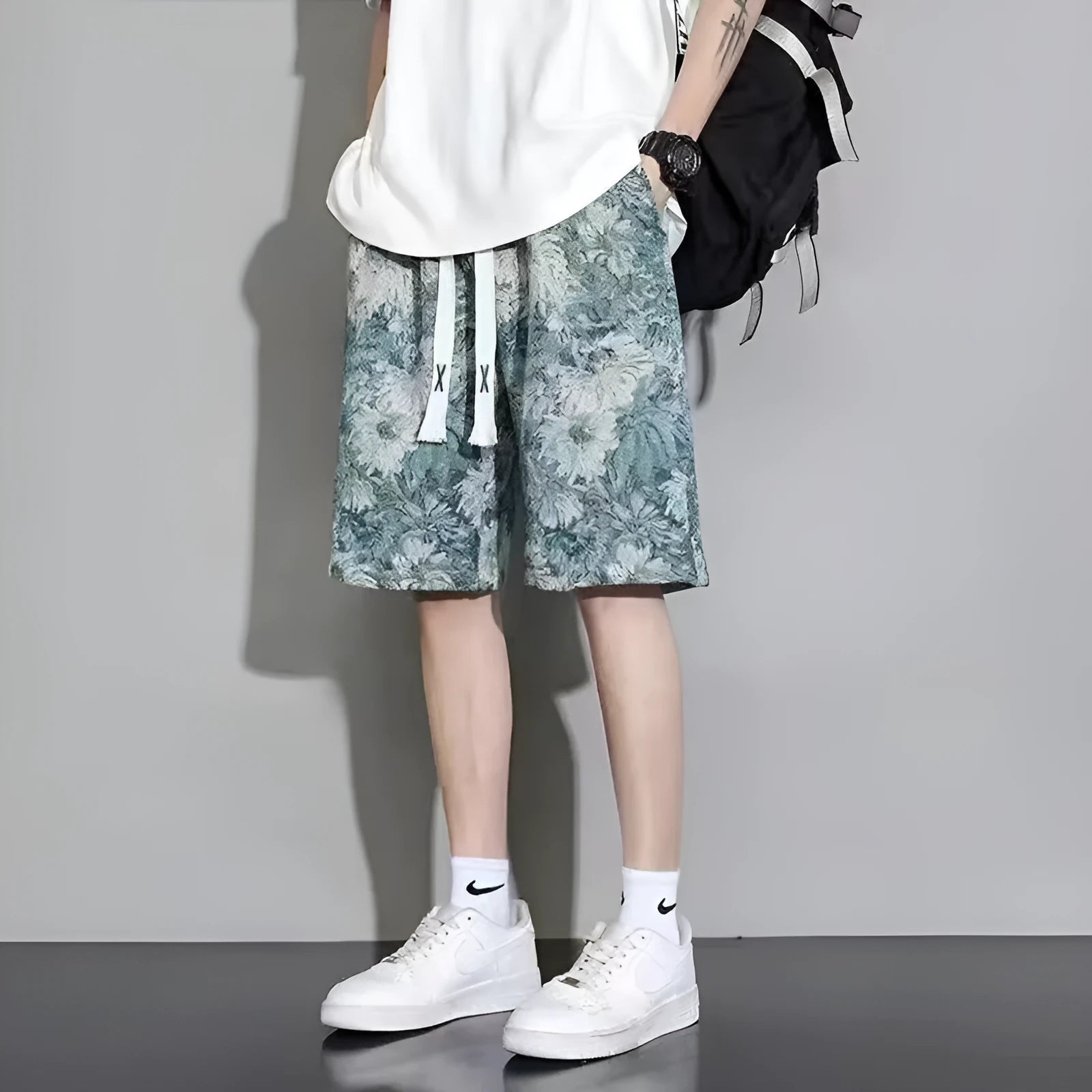 Men's polyester summer shorts in fifth pants length, showing colour options and size range