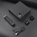 Men's black full-body waterproof electric shaver with ceramic blade and comb attachments