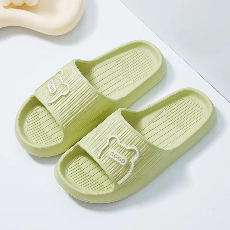 Unisex cartoon bear EVA slippers in light green with open toe and flower detail for bathroom use