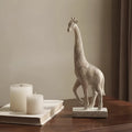 Wood colour European style synthetic resin giraffe ornament measuring 30.5cm tall.
