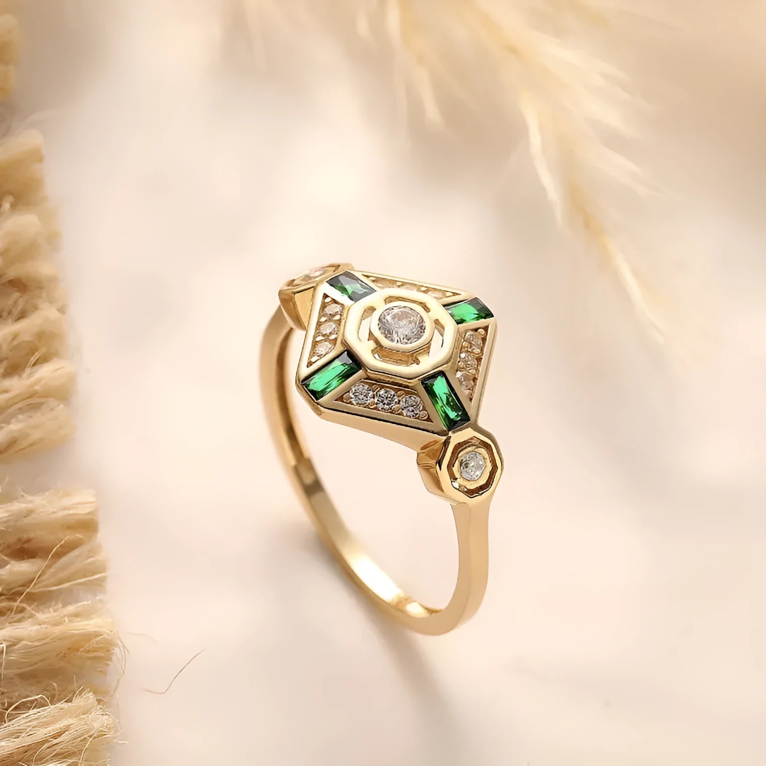 Square geometric emerald diamond ring in lvzuan colour on a model's finger.