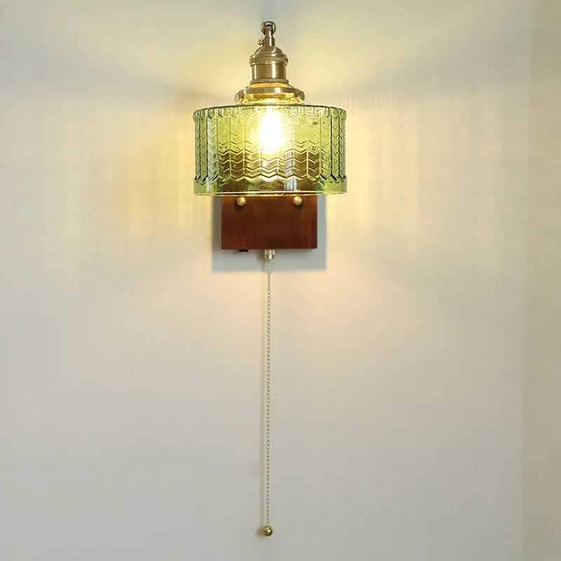 American retro wall lamp with walnut glass brass construction, green glass shade, installed on living room wall