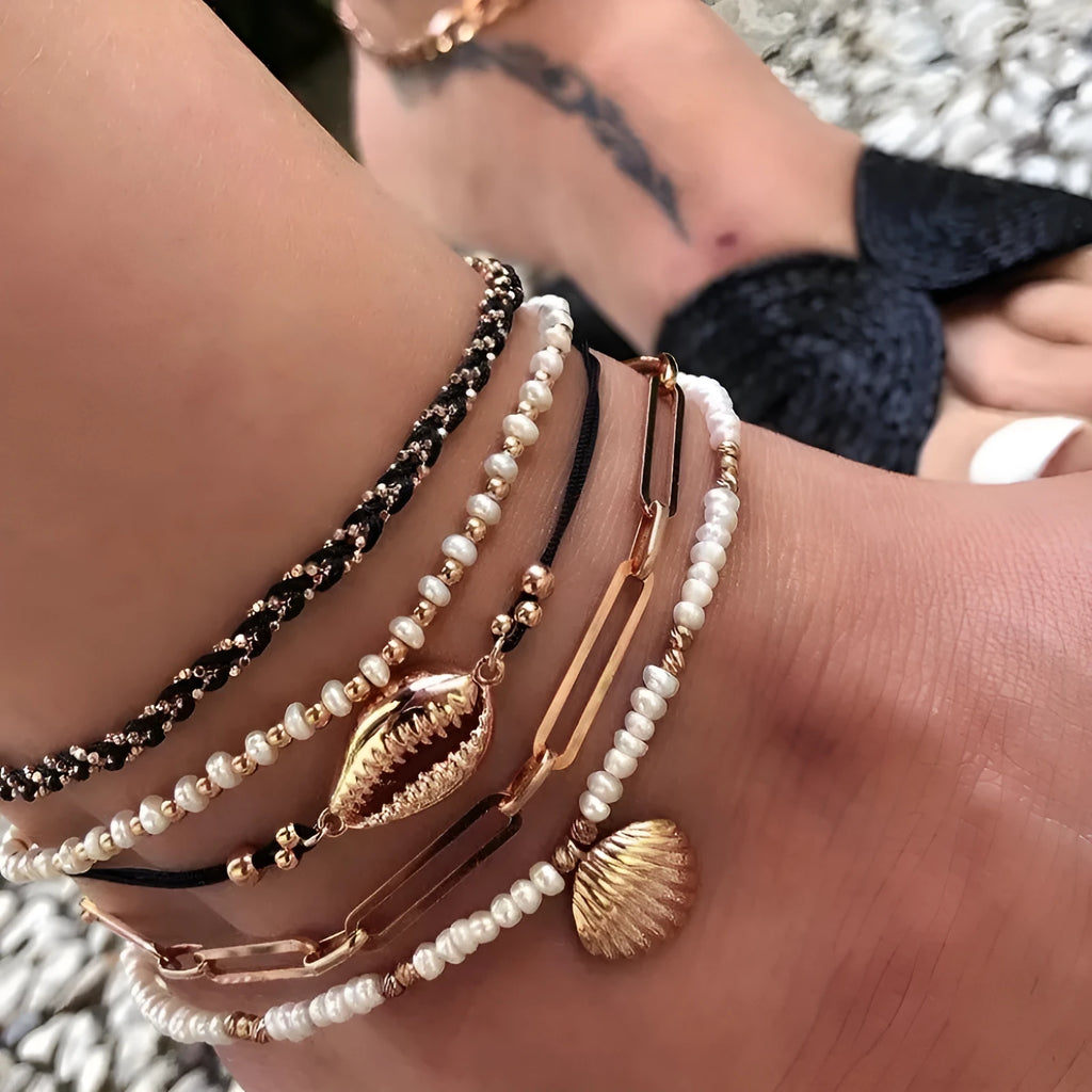 Five-piece gold tone anklet set with braided, shell and geometric ethnic style anklets for women