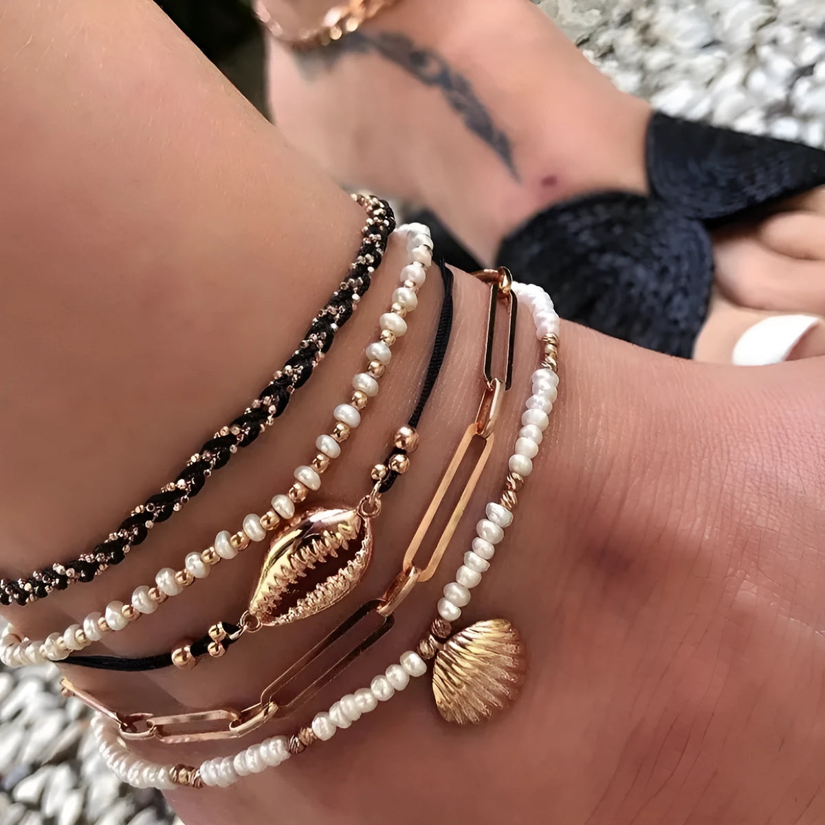 Five-piece gold tone anklet set with braided, shell and geometric ethnic style anklets for women
