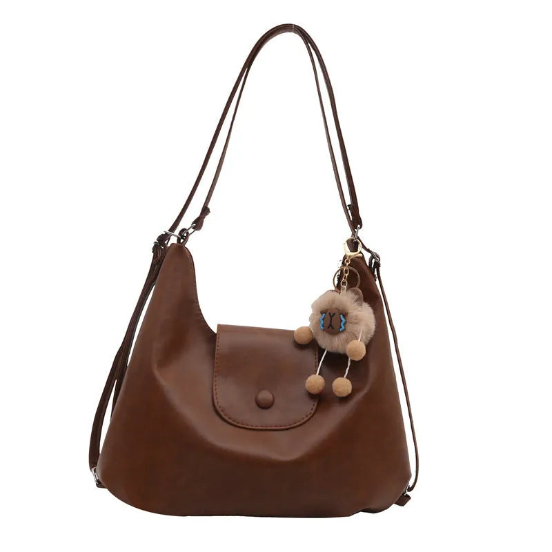 Women's textured PU leather commuter shoulder bag with horizontal design and single strap