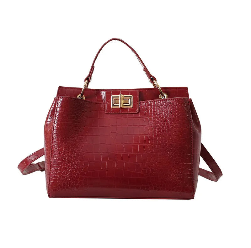 Retro western style messenger bag in black stone pattern with shoulder strap and square vertical shape