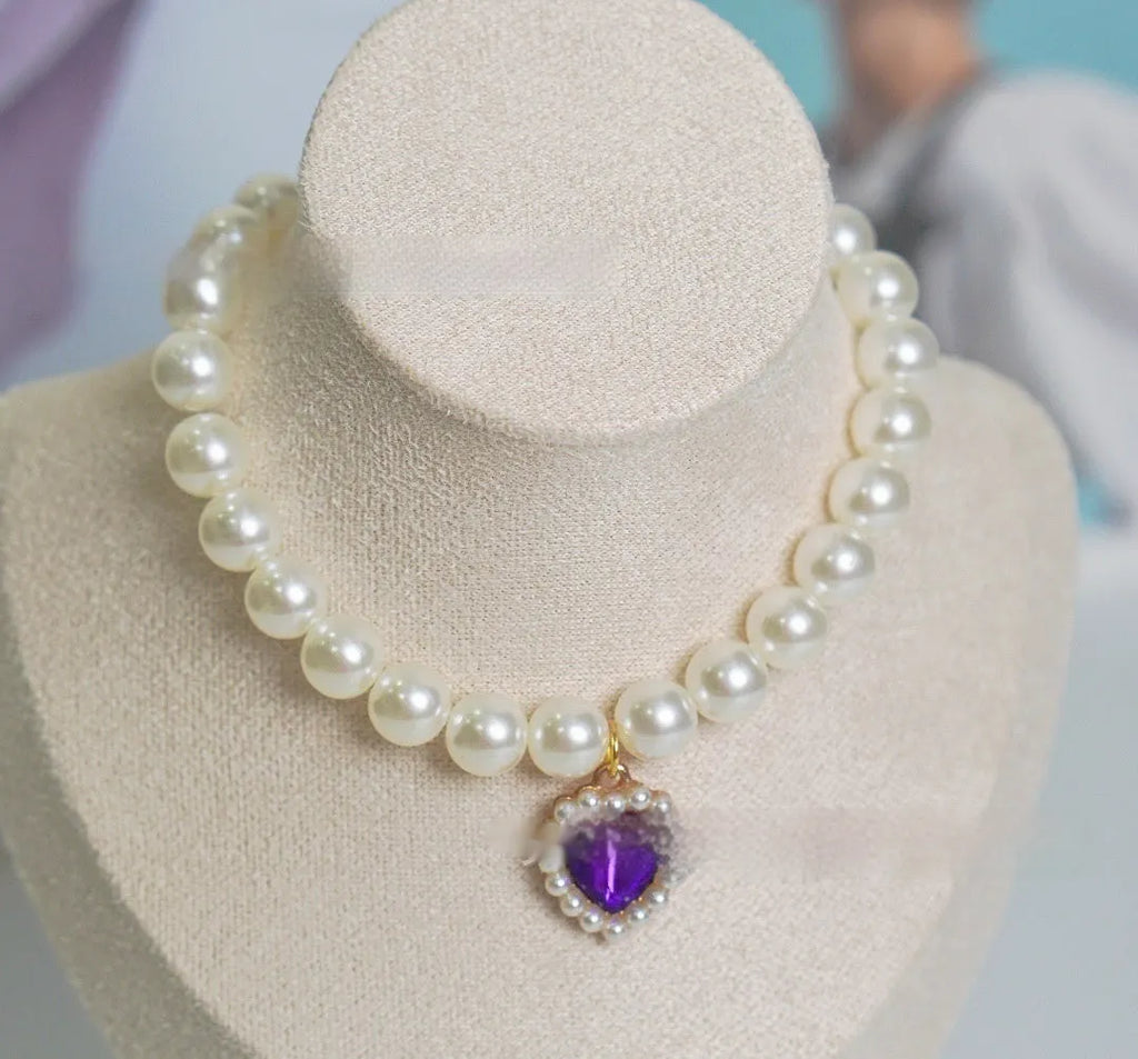 A decorative gem-style cat collar in plastic alloy resin, shown in multiple solid colours with adjustable sizing.