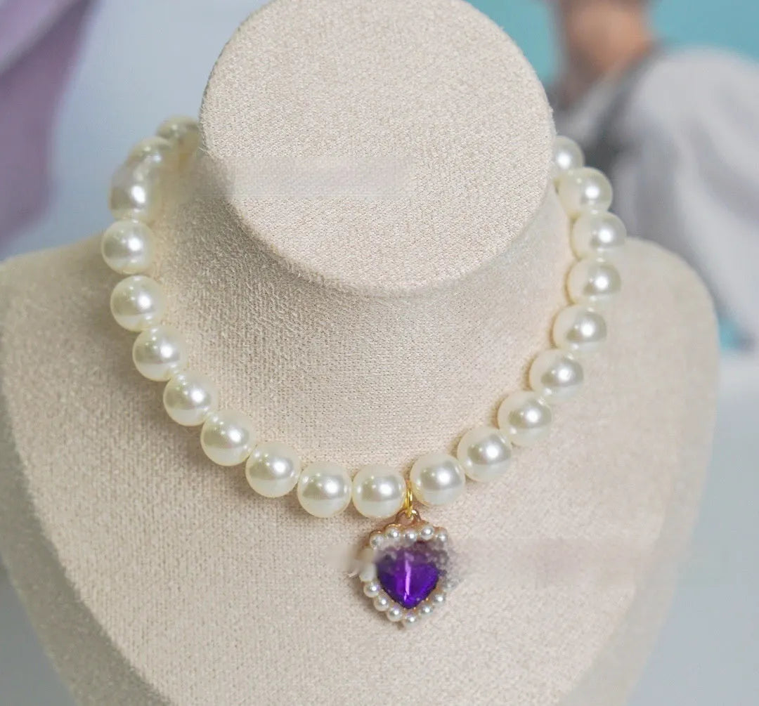 A decorative gem-style cat collar in plastic alloy resin, shown in multiple solid colours with adjustable sizing.
