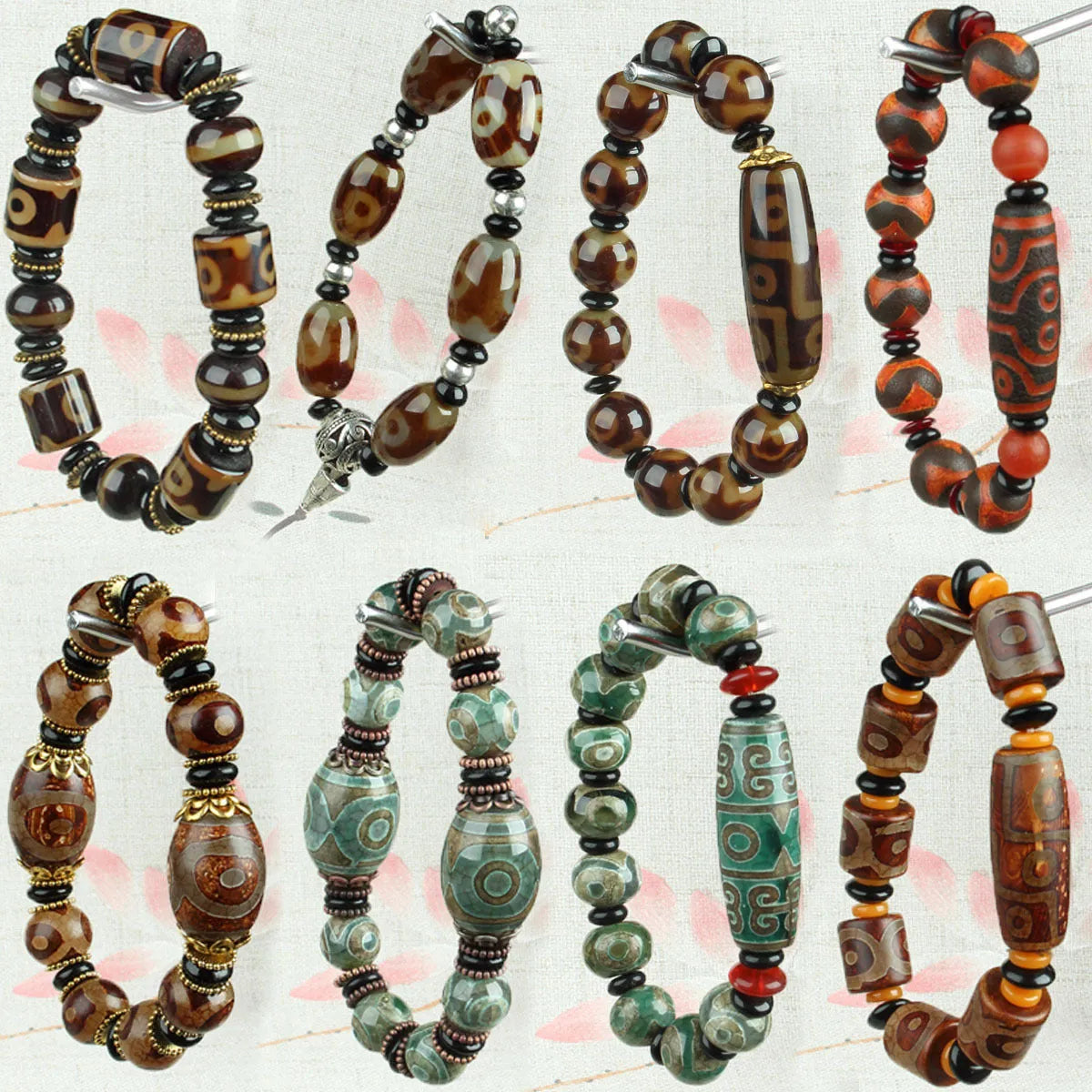 Distressed agate Tibet bead bracelet with three-eye design and polished finish on a wrist.