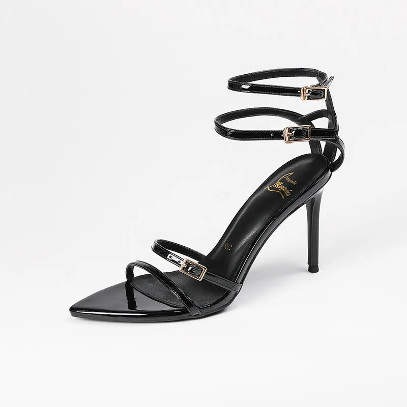 Black patent leather women's ankle-strap stiletto sandals with open toe and 8cm high heel.