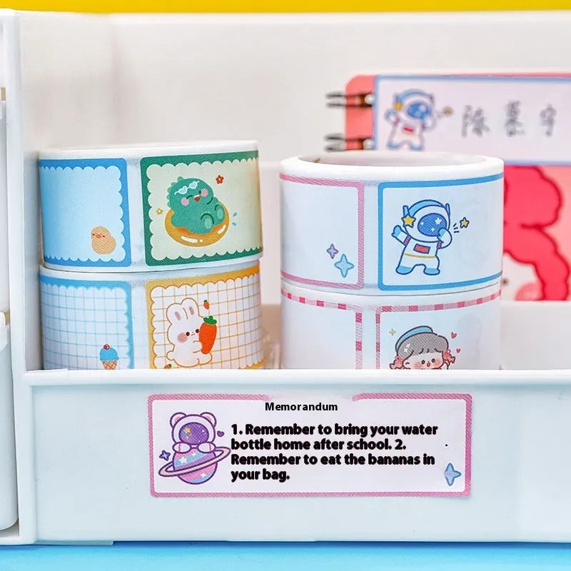 Roll of cartoon name tape stickers showing dinosaur, astronaut, rabbit, and girl cute design themes.