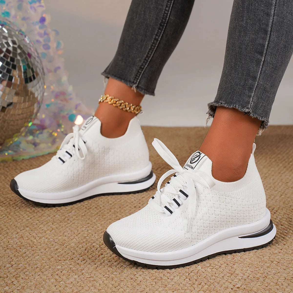 Women's black and white mesh platform sneakers with lace-up front and rubber sole
