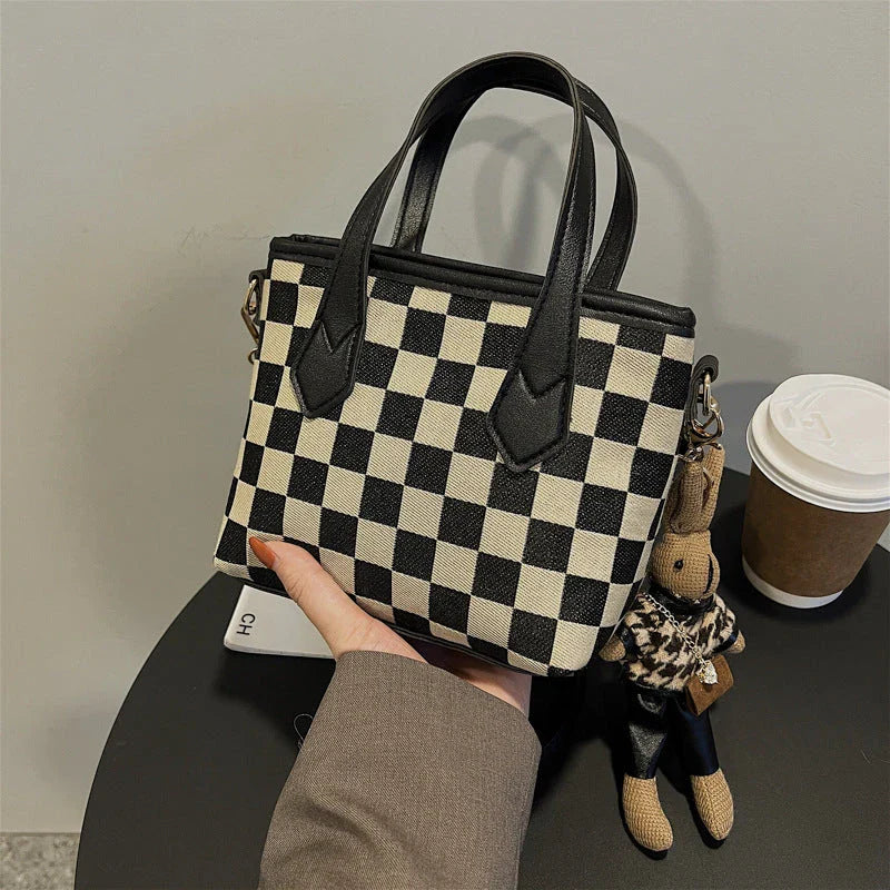 Stylish houndstooth shoulder bags in various colors, featuring a spacious square shape, adjustable strap, and classic checkerboard pattern.