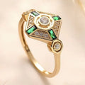 Square geometric emerald diamond ring in lvzuan colour on a model's finger.