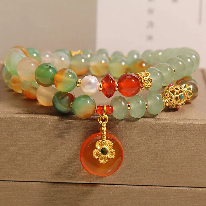 Peacock green agate double ring bracelet for women with safety buckle clasp and rhinestone details.