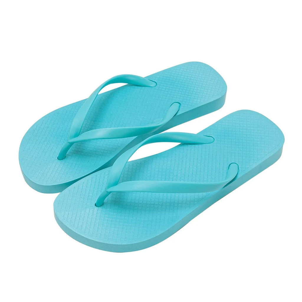 Orange and black flat beach slippers with hollow-out plastic uppers and textured non-slip PVC soles.