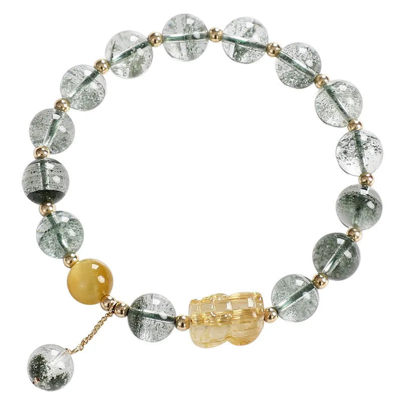 Green phantom quartz bracelet with gold rutile inclusions and geometric ethnic design