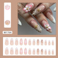 One pair of French style plastic false nails with a simple floral rock design and a bottle of nail glue.