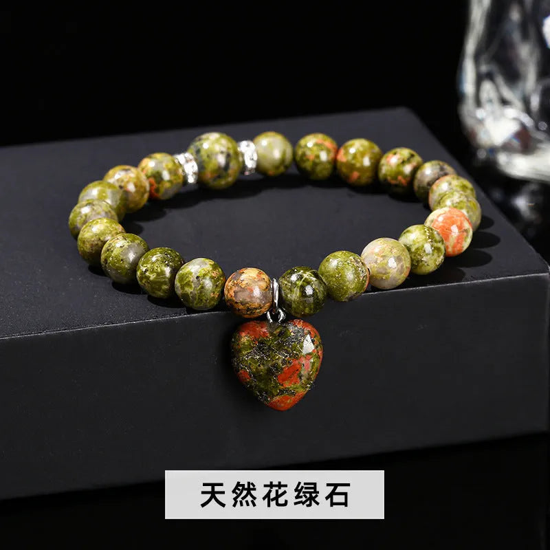 Handmade geometric love pendant bracelet with natural crystal beads in pink, green, white, or yellow.