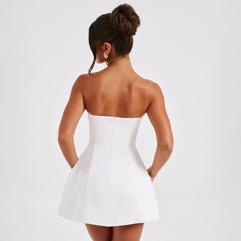 Stylish backless summer mini dress in various vibrant colors with an open back design and short length for a flattering and versatile look