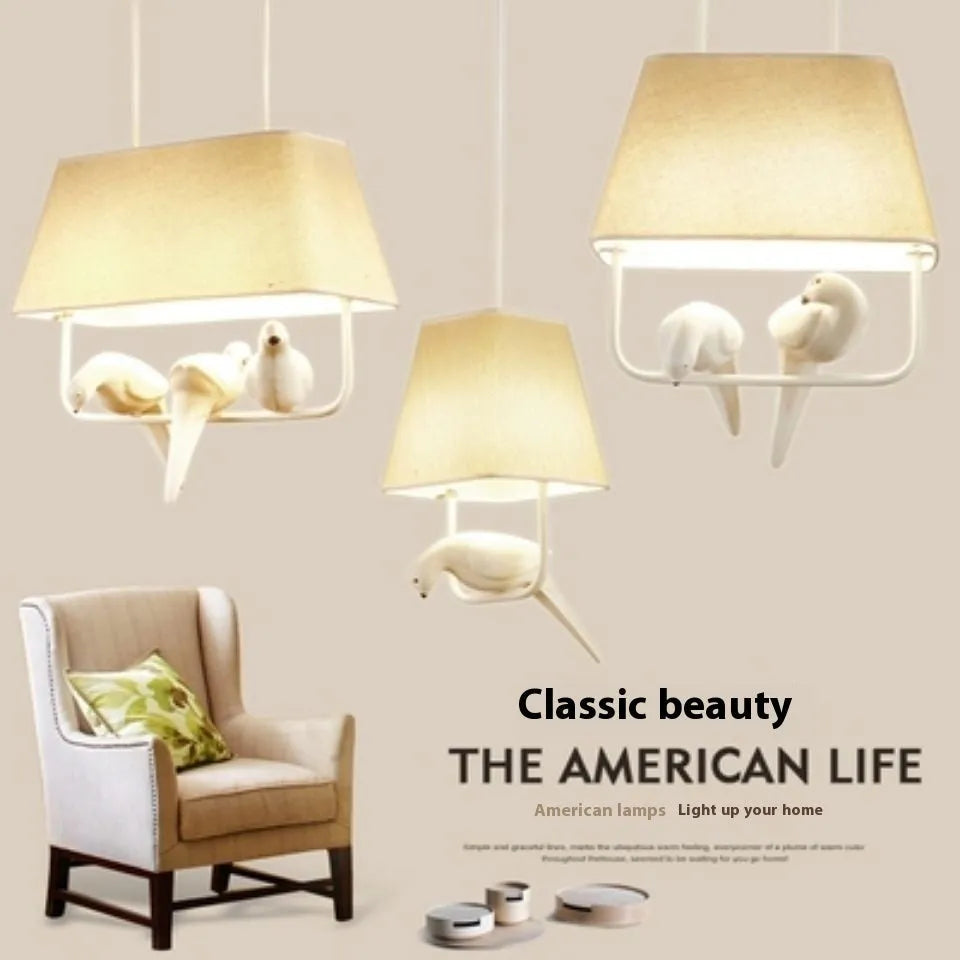 Iron bird chandelier ceiling lamp with fabric shade in a multi-bird design